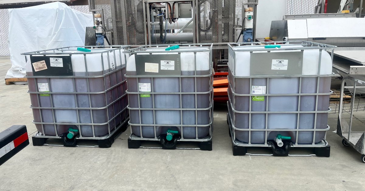IBC totes of expired and off-spec food-grade oil staged for evaluation